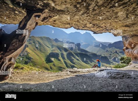 Woman Hiking Sitting In Front Of Big Cave Pillar Cave Garden Castle