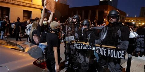 Viral Photo Shows Louisville Cop Protected By Black Protesters When Separated From Squad During