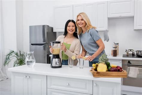 Smiling Interracial Women Holding Blender With Stock Image Image Of Friends Indoors 265513975