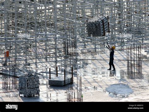 Chinese Migrant Workers Labor At The Construction Site Of The Huai An