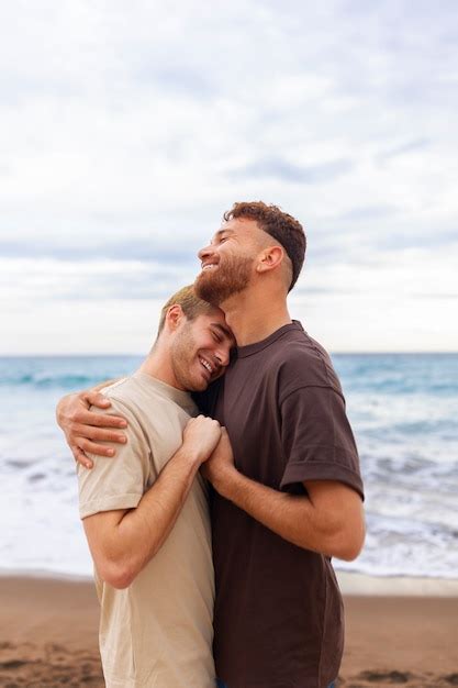 Free Photo Affectionate Gay Couple Spending Time Together On The Beach