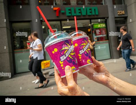 A Slurpee Lover Displays Her Slurpees Outside A 7 Eleven Store In New