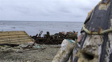 Ruins Of Fishing Boats And Garbage On Seashore Clip Garbage And Ruins