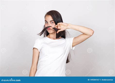 Young Beautiful Woman With A Mustache From Their Hair Stock Image