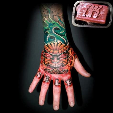 Tiki Hand Tattoo By Fabian Danger De Gaillande Tattoonow