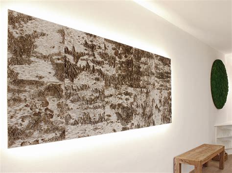 a large painting hanging on the wall next to a wooden table and bench ...