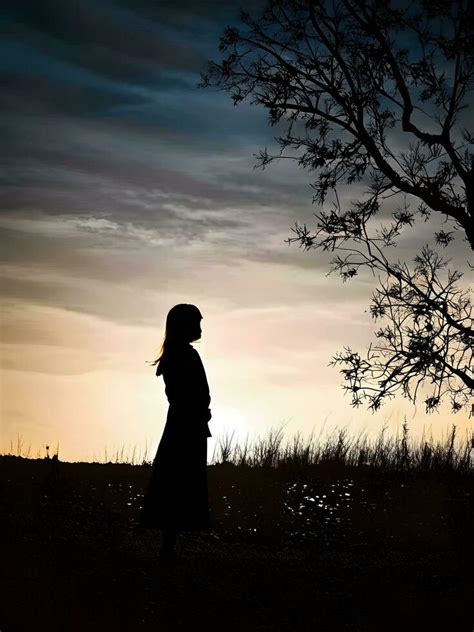 Silhouette Of A Lonely Woman Stands Alone 30761395 Stock Photo At Vecteezy