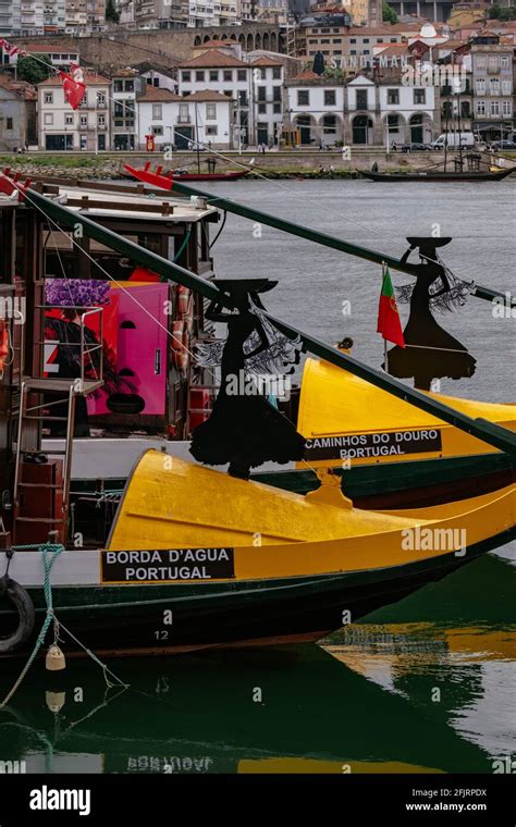 Traditional And Iconic Rabelo Boats Moored In Douro River Cloudy Sky