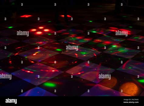 Disco dance floor. Light on dance floor. Colored spots on floor. Lights ...