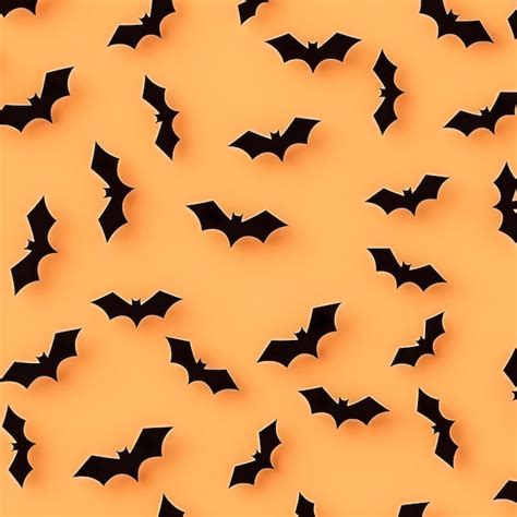 Premium AI Image | Pattern bats halloween Silhouette of bats on orange ...