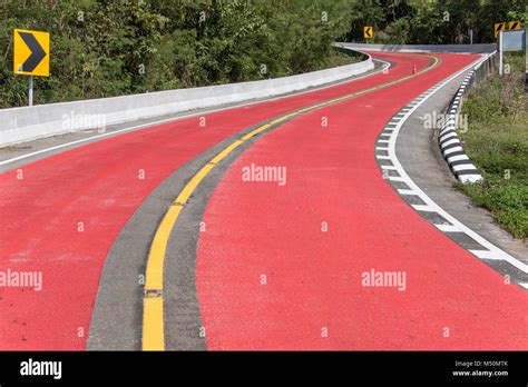 Empty Red Road With Curves Warning Road Surface With Serpentines In