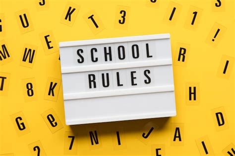 Premium Photo School Rules Lightbox Message On A Bright Yellow Background