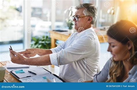 Struggling To Read My Messages A Mature Businessman Struggling To Use