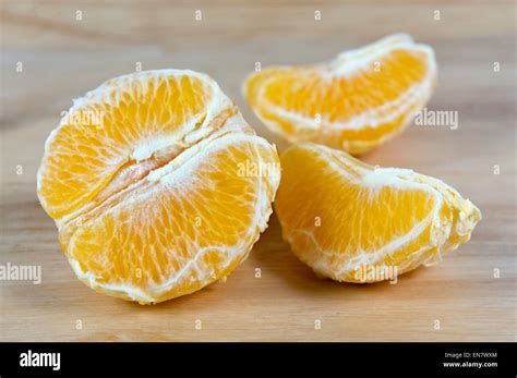 Half Peeled Orange On Chopping Board Stock Photo Alamy