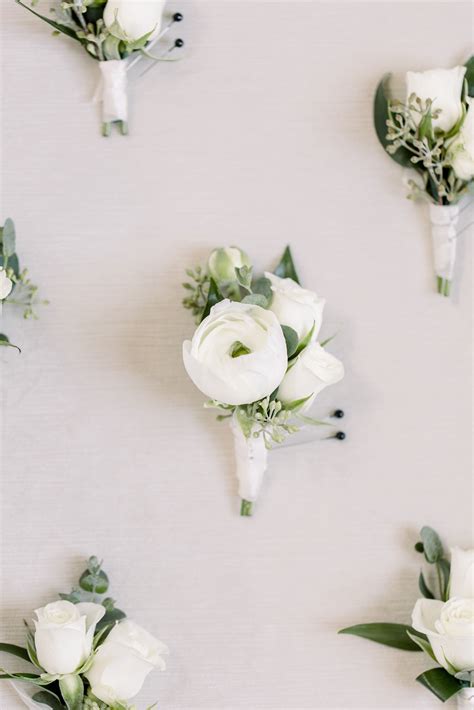 A Grooms Boutonniere Stands Out With Small White Ranunculus Ranunculus