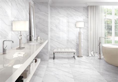 A Large Bathroom With White Marble Walls And Flooring Along With A