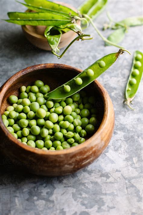 "Shelling Peas." by Stocksy Contributor "Darren Muir" - Stocksy