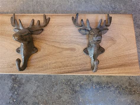 Cast Iron Stag Heads On An English Walnut Board Coat Hooks Wall