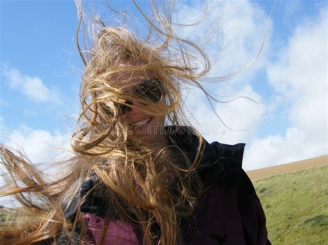 Hair blowing in the wind stock photo. Image of glasses - 12823042