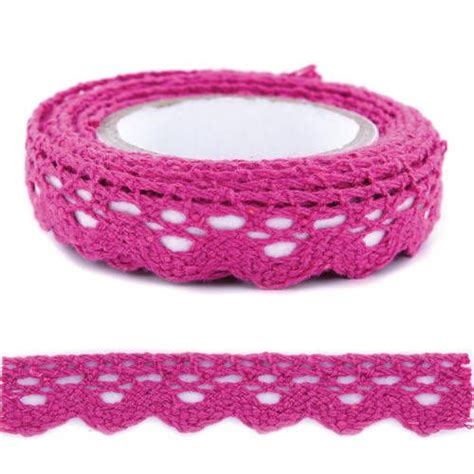 A Roll Of Pink Crocheted Lace Next To A Roll Of White Crochet