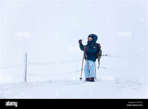 Boy Snowshoeing On Snowy Hillside Stock Photo Alamy