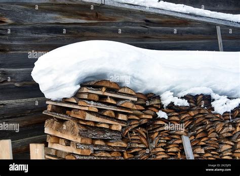 Wood Piled In A Woodpile Under The Snow In Winter Stock Photo Alamy