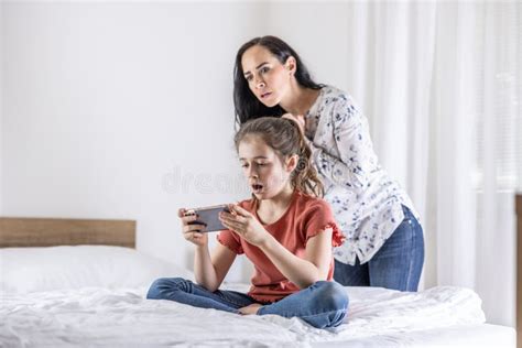 Daughter Watches Shocking Video On A Phone While Her Mother Tries To