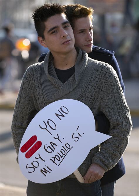 Santiago A Gay Couple Holds A Sign Reading I Am Not Gay My Boyfriend Is