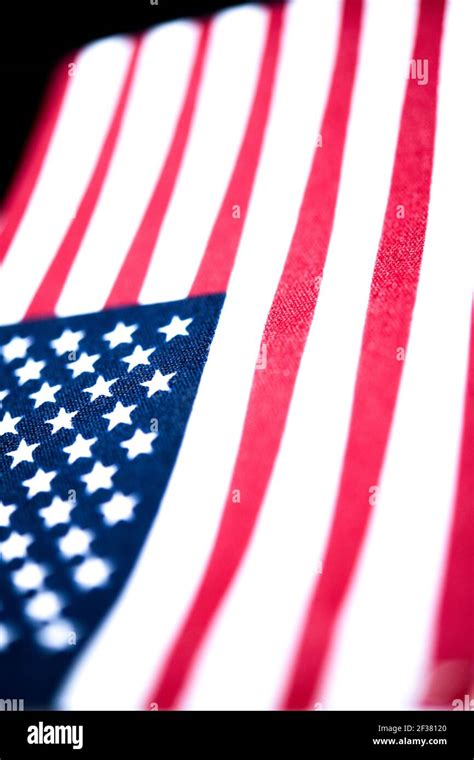 A Macro Shot With Selective Focus Of A Small Handheld American Flag On
