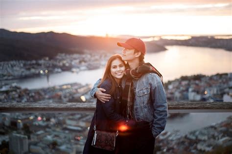 Premium Photo Couple Of Love Is Enjoying Travel In Bergen Norway