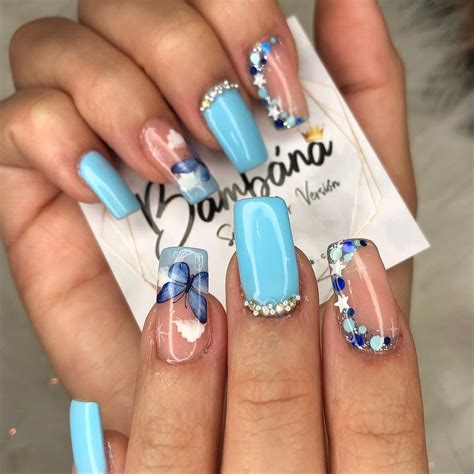 Uñas acrilicas Ibague on Instagram Uñas azules con mariposas Baño en