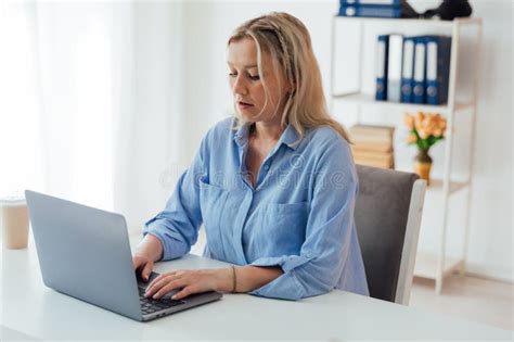 Woman Blonde Working In Office Online Internet On Laptop Stock Image Image Of Woman Looking