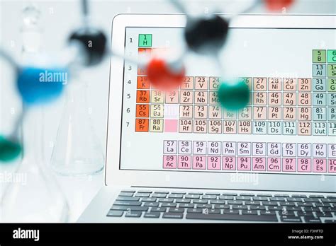 Lap Top With Periodic Table And Ball And Stick Molecular Model Stock