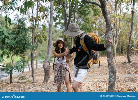 Happy Lgbt Lesbian Couple Travelers Hiking With Backpacks In Forest Trail Lgbt Lesbian Couple