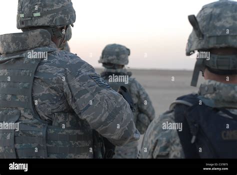 Usaf Airman Watching Sunrise Near Al Udeid Air Base Qatar Stock Photo