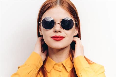 Premium Photo Portrait Of Young Woman Wearing Sunglasses Against White Background