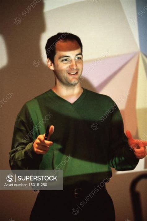 Businessman Giving A Presentation In An Office Superstock