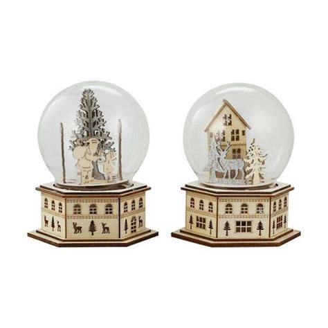 Two Snow Globes Sitting On Top Of Each Other