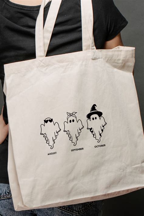 Spooky Season Vibes Three Ghostly Friends On A Canvas Tote Bag