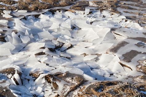 Premium Photo A Thick Layer Of Ice Formed On The Territory Of The Field