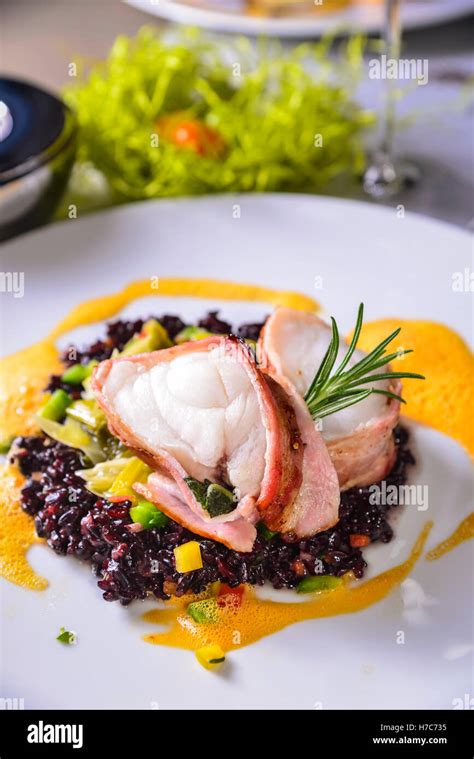 Fish Fillet With Purple Rice Innsbruck Austria Stock Photo Alamy