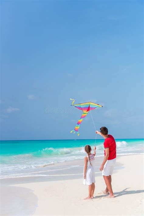 Family Flying Kite On Tropical Beach Stock Image - Image of parenting ...