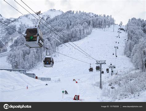 Cableway ski lift cabins on snowy mountain background beautiful winter ...