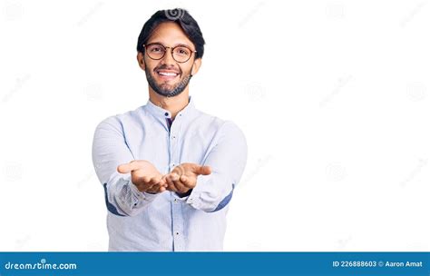 Handsome Hispanic Man Wearing Business Shirt And Glasses Smiling With