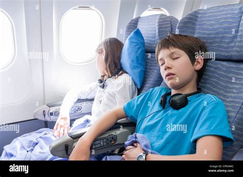 Children Sleeping On Airplane Stock Photo Alamy