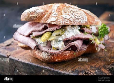 Traditional Sliced Cold Cuts Roast Beef Sandwich With Onion Stock Photo