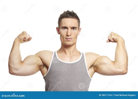 Muscular Young Man Flexing Arm Muscles In Sports Outfit Stock Photo