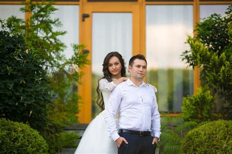 Stylish Gorgeous Happy Brunette Bride And Elegant Groom On The B Stock