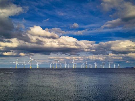 Premium Photo Offshore Wind Turbine In A Windfarm Under Construction Off The England Coast At