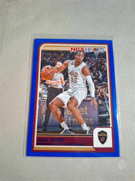 2023 24 PANINI NBA HOOPS BLUE PARALLEL 104 ISAAC OKORO CLEVELAND